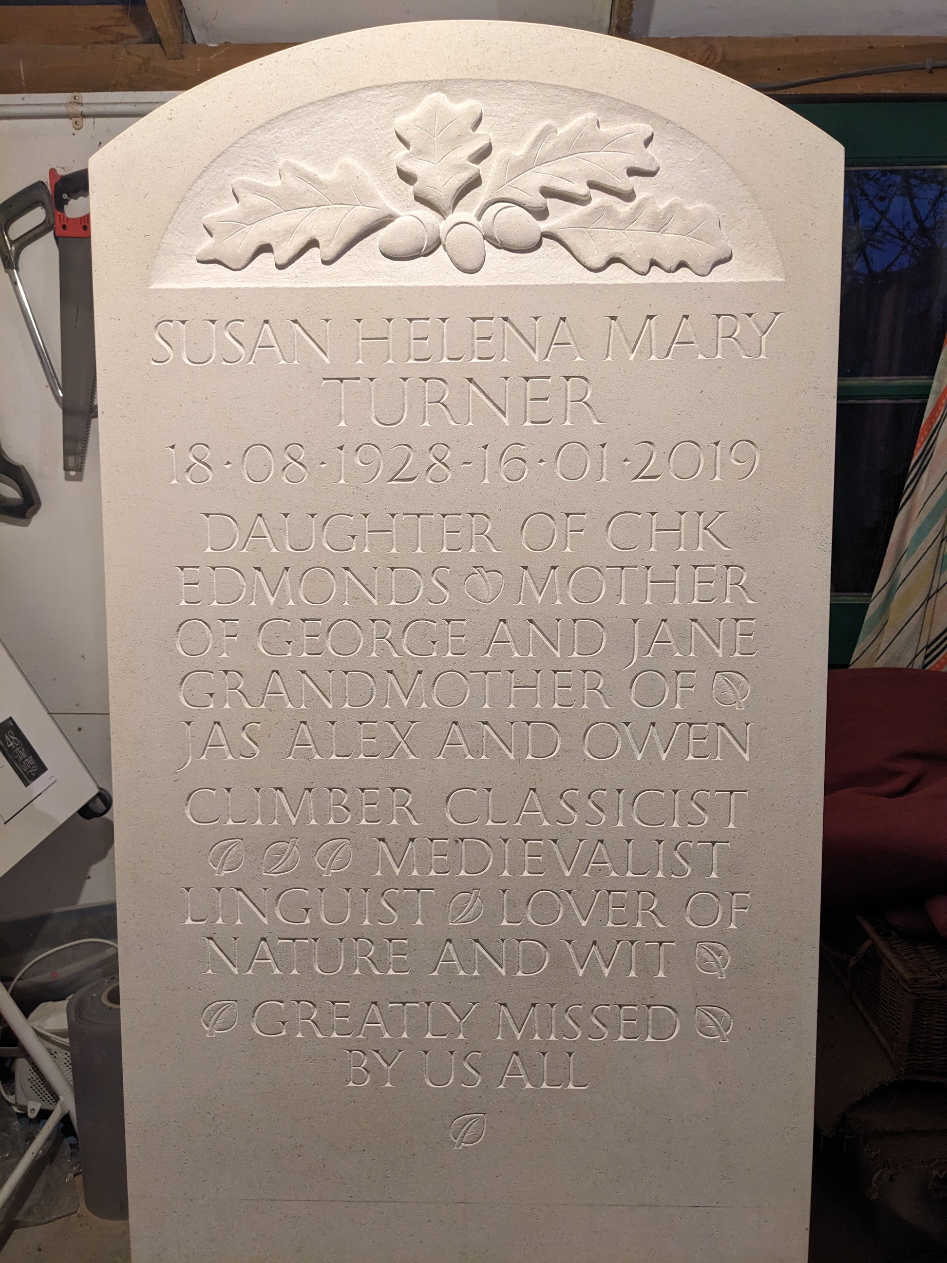 limestone headstone hand carved oak leaves